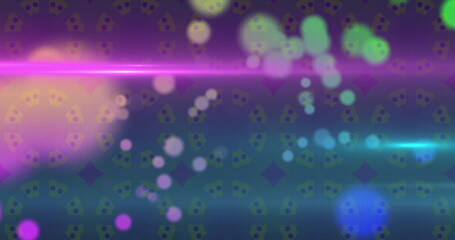 Image of colourful spots moving over light spots