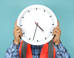 Hand holding a wall clock. Ideal for illustrating time management, reminders, or the concept of...