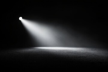 A lamp post standing tall with a bright, lit candle on it in the dark of night