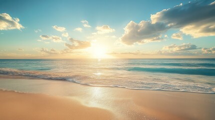 Obraz premium A Beautiful Sunrise Over the Beach and the Sparkling Ocean Waters