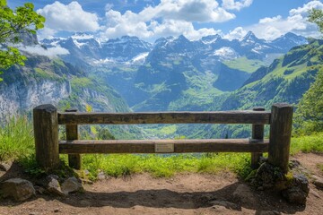 Fototapeta premium Scenic Viewpoint with Wooden Bench Overlooking Majestic Mountains