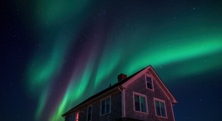 Fototapeta premium A serene night scene featuring a house under the mesmerizing aurora borealis in a tranquil setting - cape cod home