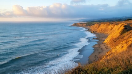 A beautiful coastal landscape depicts a sea meeting cliffs at sunset