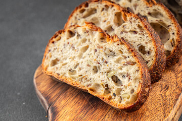 Grain bread sunflower, chia, flax seed, cut oats fresh tasty food dish delicious gourmet food background on the table rustic food top view copy space vegetarian and vegan food