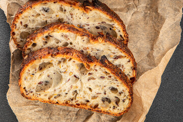 Grain bread sunflower, chia, flax seed, cut oats fresh tasty food dish delicious gourmet food background on the table rustic food top view copy space vegetarian and vegan food