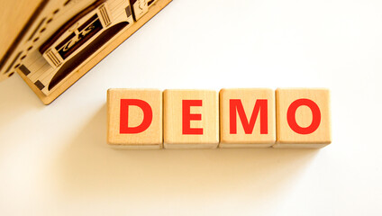 Demo symbol. Concept word Demo on beautiful wooden blocks. Beautiful wooden house. Beautiful white...