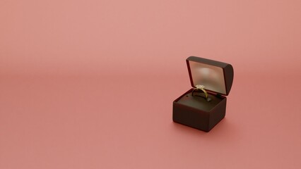 Elegant gold ring in black velvet box on champagne background