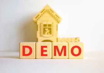 Demo symbol. Concept word Demo on beautiful wooden blocks. Beautiful white table white background. Wooden beautiful house. Business and demo concept. Copy space.