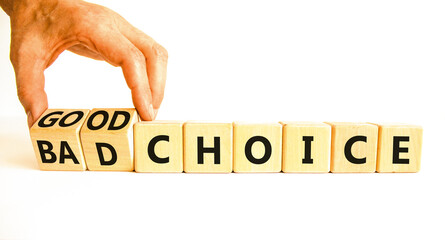 Good or bad choice symbol. Concept words Good choice or Bad choice on beautiful wooden blocks. Beautiful white table white background. Businessman hand. Business good bad choice concept. Copy space.