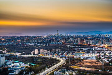 Obraz premium The urban context of Beijing outlined by the expressway in Beijing, China in the evening