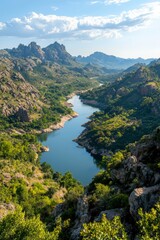 Serene river winding through mountain valley on sunny day for travel, nature