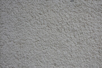 Texture of old rough plaster close-up.