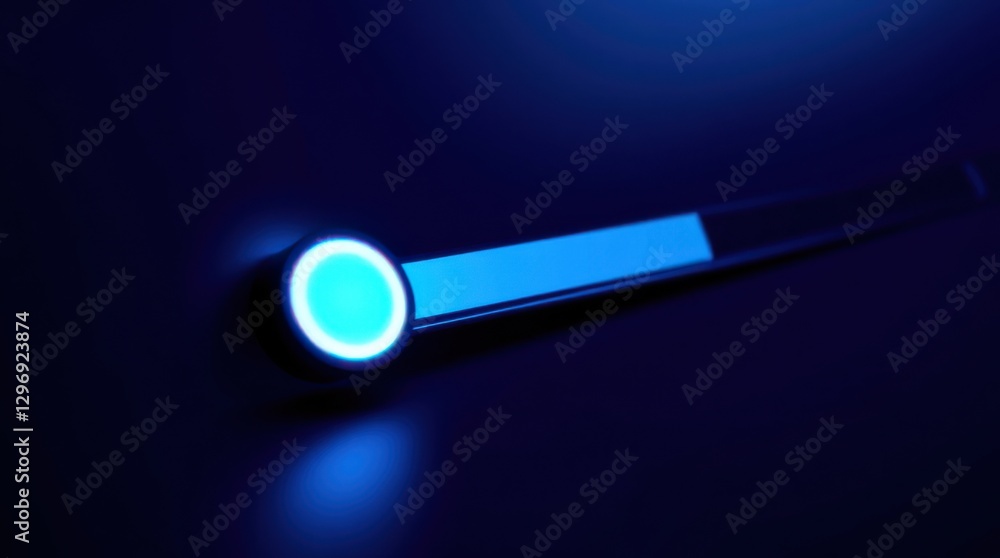 Poster blue illuminated button and bar on a dark surface, suggesting power or status indication in dim cond