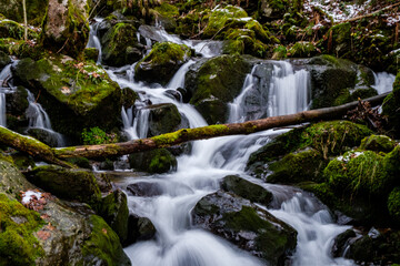 Obraz premium The view of the waterfall right before the spring in south Germany