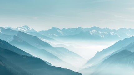 Obraz premium Misty Mountains with Snow-Capped Peaks in Serene Light