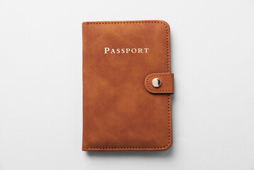 Passport in leather cover on grey background, top view