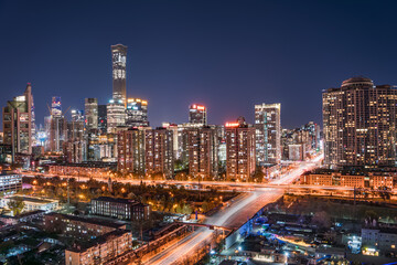 High-rise buildings and flowing traffic under the night view of a prosperous metropolis in China © 文普 王