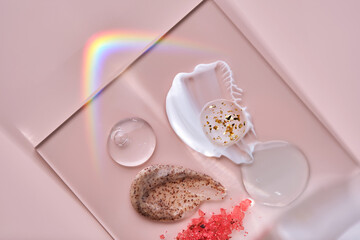 Different textures of skin care products on a square stand with beautiful caustics.