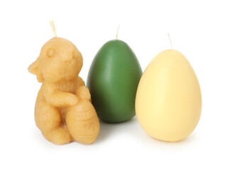 Bunny and egg shaped candles isolated on white. Easter decor