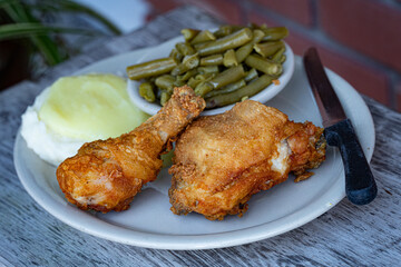 Fried Chicken with Mashed Potatoes, Gravy and Green Beans.