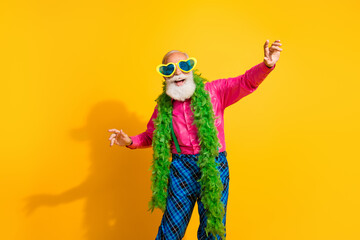 Photo of handsome pensioner mister dance have fun boa wear pink shirt retro plaid pants classy garment isolated on yellow color background
