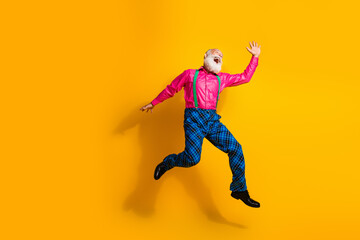 Full body photo of bearded gentleman jump have fun wear fashionable clothes suspenders isolated on...