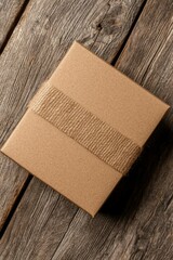 Brown box with jute rope on weathered wood, gift concept for lifestyle images