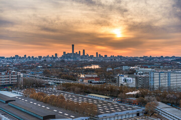 A panoramic bird's-eye view of the city of Beijing, China at sunset