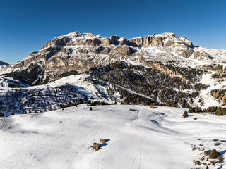 Italian Dolomites drone aerial view in winter snow ski sunny days. Sella Ronda Marmolada .Aerial...