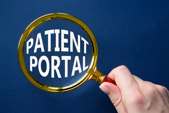 Patient Portal symbol. Magnifying glass with words Patient Portal. Businessman hand. Beautiful deep blue background. Medicine and Patient Portal concept. Copy space.