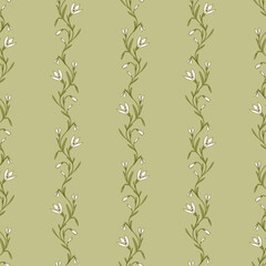 Seamless pattern of snowdrop flowers in spring on soft green background