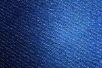 Blue Denim Fabric Texture: Close-up of classic blue denim fabric, showcasing the luxurious texture, weave, and indigo hue for a stylish backdrop.