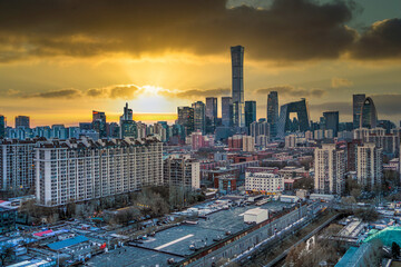 A bird's-eye view of the urban buildings in Beijing, China under the setting sun