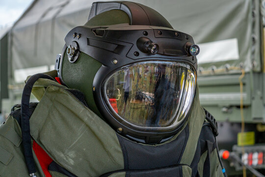 Bomb disposal technician protective helmet with visor during preparation for explosive ordnance disposal operations