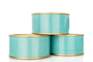 Three metal cans of tuna, close-up, isolated on a white background.