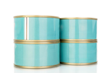 Four metal cans of tuna, close-up, isolated on a white background.