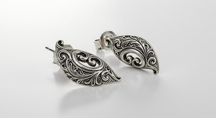 Fototapeta premium Elegant Silver Earrings with Intricate Scrollwork Design for Fashionable Style