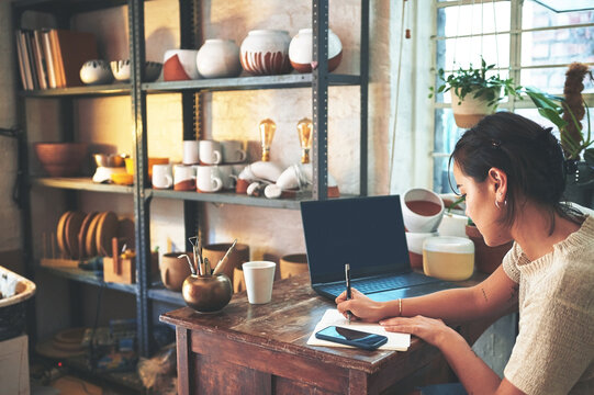 Notebook, writing and pottery with woman in studio for ceramic inventory, clay and laptop mockup. Small business, sculptor checklist and artist with person in workshop for gallery, order and startup