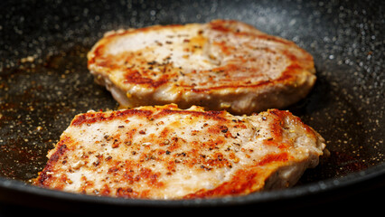 Preparing port steak on cooking pan