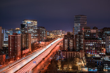 Obraz premium The resplendent and colorful urban roads and tall buildings in Beijing, China under the night view