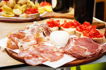 Delicious Italian appetizers featuring cured meats, cheese, and bruschetta in Naples