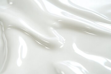 A close-up shot of a white liquid substance in a container