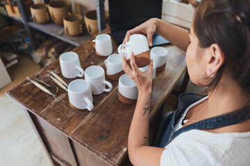 Artist, ceramics and woman in pottery workshop for manufacturing of clay products. Creative, design...