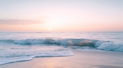 The peaceful ocean waves crash onto the sandy shoreline at sunset