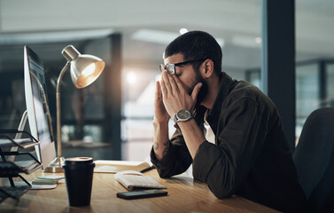 Computer, eye strain and headache with man in office for website coding or programming deadline. Burnout, fatigue and stress with frustrated programmer employee in creative workplace for overtime