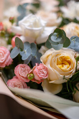 A Stunning Arrangement Featuring a Beautiful Bouquet of Pink and White Roses Alongside Lilies