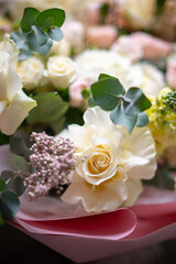 A Stunning Arrangement Featuring a Beautiful Bouquet of Pink and White Roses Alongside Lilies