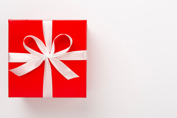 Open red gift box on color background, top view