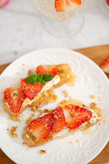 Strawberry and cottage cheese sandwich on white table