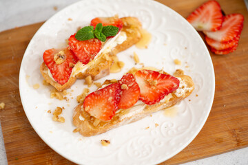 Strawberry and cottage cheese sandwich on white table